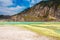 The yellow sulphur deposits and blue lake of Kawah Putih, Indonesia