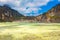 The yellow sulphur deposits and blue lake of Kawah Putih, Indonesia