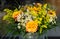 Yellow summerflowers in vase - yellow orange rose and chamomille