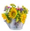 Yellow sunflowers and colored wild flowers in a white sprinkler, close up