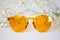 Yellow sunglasses with delicate flower decor