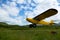 Yellow Super Cub bush plane taking off