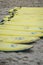 Yellow surfing boards on a beach