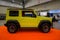 Yellow Suzuki Jimny in a car show