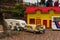 Yellow swedish house and car with caravan made of Lego