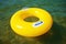 Yellow swim ring floating