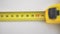 Yellow tape measure, roll of measuring tape