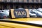 Yellow taxi icon sign in the street