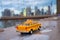 Yellow taxi model on the empty Brooklyn Bridge in New York during the coronavirus lockdown