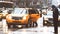 Yellow taxi in rainy evening in manhattan with person getting into a cab