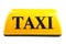 Yellow taxi roof sign on white background