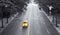 Yellow taxi speeding down 42nd Street through New York City