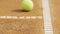 Yellow tennis ball lying on court, professional sport, active hobby, close-up