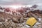 Yellow tent on mountain landscape