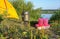 Yellow tent, red glasses, pot and gas burner, breakfast tourist on the waterfront