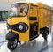 Yellow three wheeler pickup at