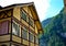 Yellow timber frame house in the Swiss Alps