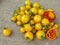 Yellow tomato Goldkrone and flowers marigolds on linen cloth