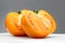 Yellow Tomato. Ripe natural tomatoe close-up. Organic tomato on grey background. Macro shot. Half of Tomato close-up