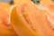 Yellow Tomato. Ripe natural tomatoe close-up. Organic tomato on grey background. Macro shot. Half of Tomato close-up