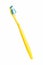 Yellow toothbrush on a white background