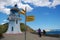 Yellow tourist sign at near old vintage lighthouse