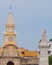 Yellow tower of cartagena church and statue