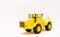 Yellow toy tractor realistic miniature