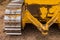 Yellow Tractor on crawler track. Close-up of crawler bulldozer truck. Earthmoving heavy machinery