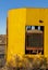 Yellow tractor radiator and blue sky