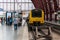 Yellow train with people on the platform of Antwerpen-Centraal railway station.