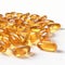 yellow transparent fish oil supplement capsules isolated on white background