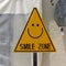 Yellow triangle sign, smile zone