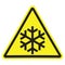 Yellow triangle warning sign with black snowflake isolated