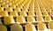 Yellow tribunes. seats of tribune on sport stadium. empty outdoor arena. concept of fans. chairs for audience. cultural