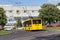 Yellow trolleybus on a city street