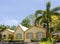 Yellow Tropical Building Under Palm Trees