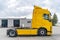 Yellow truck vehicle empty without container. Transportation industry in Europe