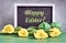 Yellow tulips, blackboard with caption