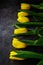 Yellow tulips flowers on dark background. Waiting for spring. Happy Easter card, women`s day, mother`s day, March 8. Flat positi