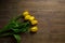 Yellow tulips lie on a background. March. bouquet of flowers. women\\\'s Day. mother\\\'s day. bouquet of yellow flowers. Flowers in M