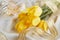 Yellow tulips, perfume and gold ribbon