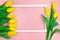 Yellow tulips side view with frame. Empty space for text. Spring and summer card. Background for Birthday, March 8