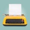 Yellow typewriter on blue