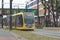 Yellow U-OV tram on the Uithoflijn is driving for test in the city of Utrecht