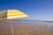 Yellow umbrella at the beach