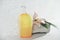 yellow unbranded bottle of cosmetic product in bathroom with water drops. floral fragranced shower gel or shampoo in a