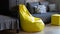 Yellow upholstered bag chair in the interior of a gray dark modern room of a teenage boy or a living room