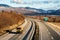 Yellow utility truck on country highway