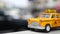 Yellow vacant mini taxi cab close up, Harmon corner, Las Vegas, USA. Small retro car model on defocused background